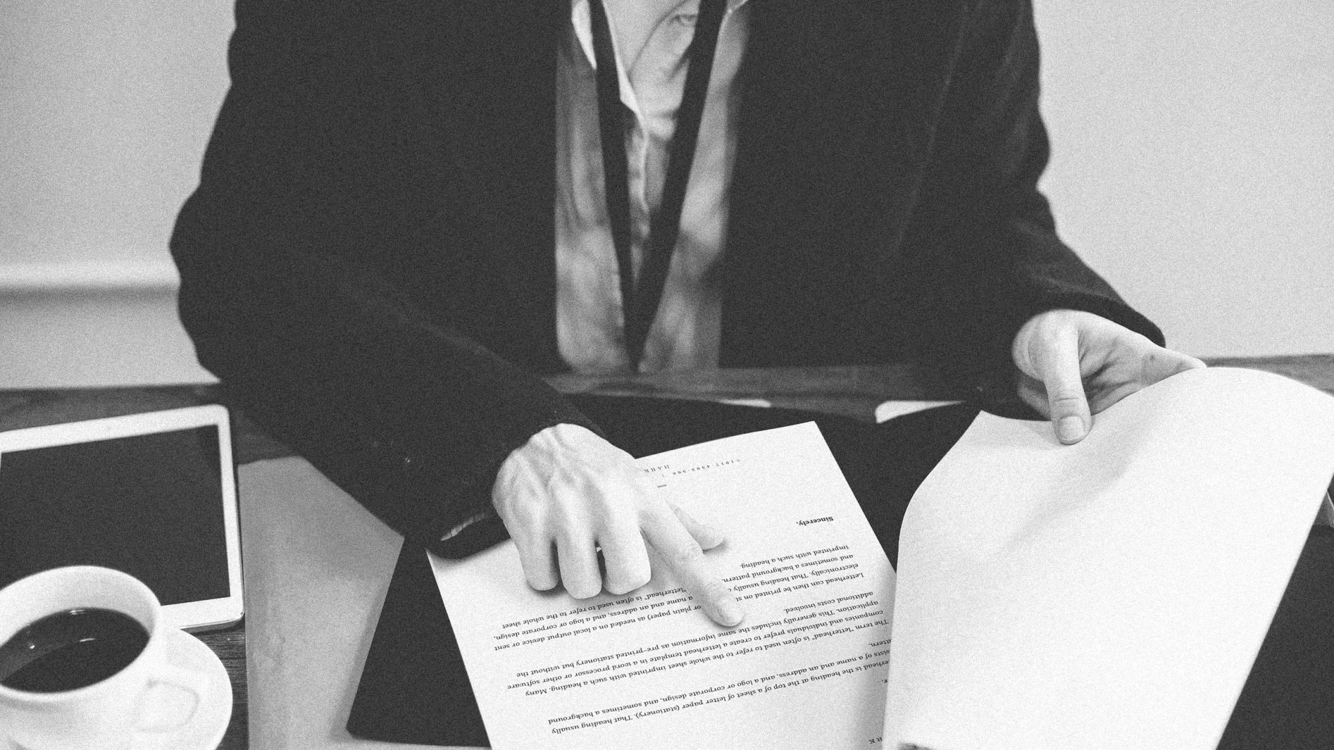 Crop businesswoman working with documents in office