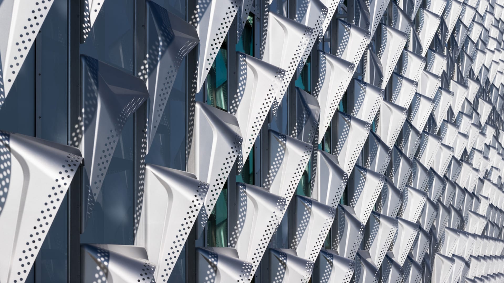 It looks like a cheese grater, but this new Harvard building has environmental superpowers