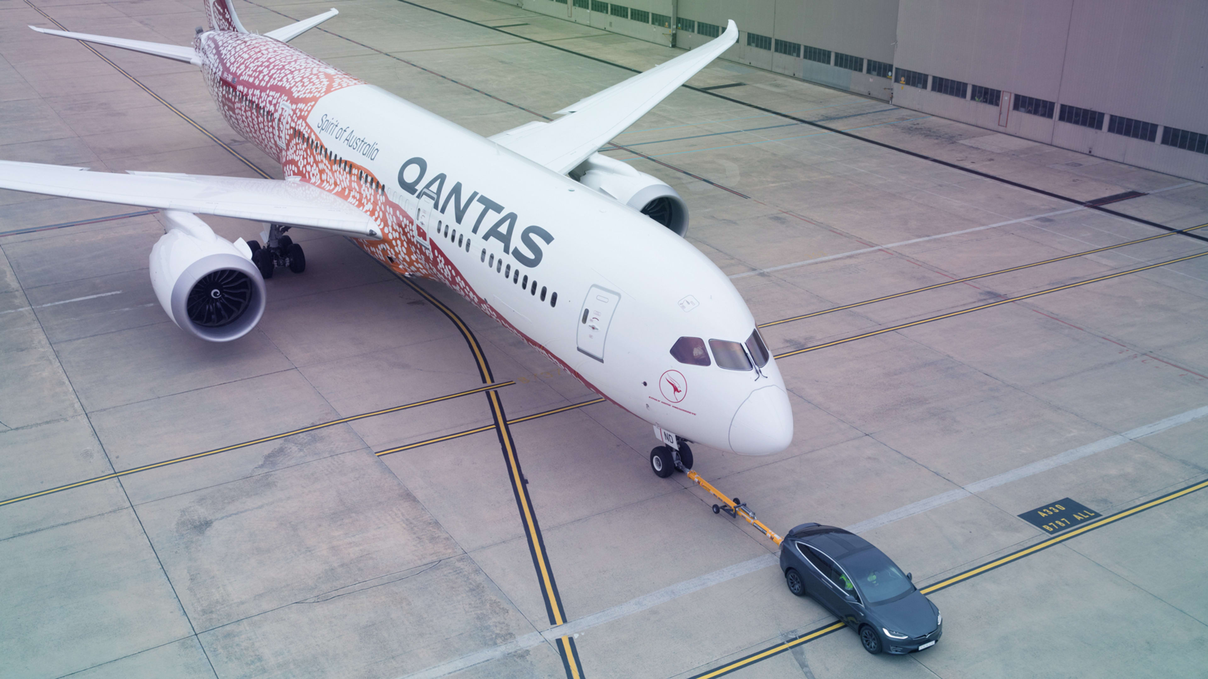 Watch a Tesla Model X tow a giant Qantas Airways Dreamliner for a good cause