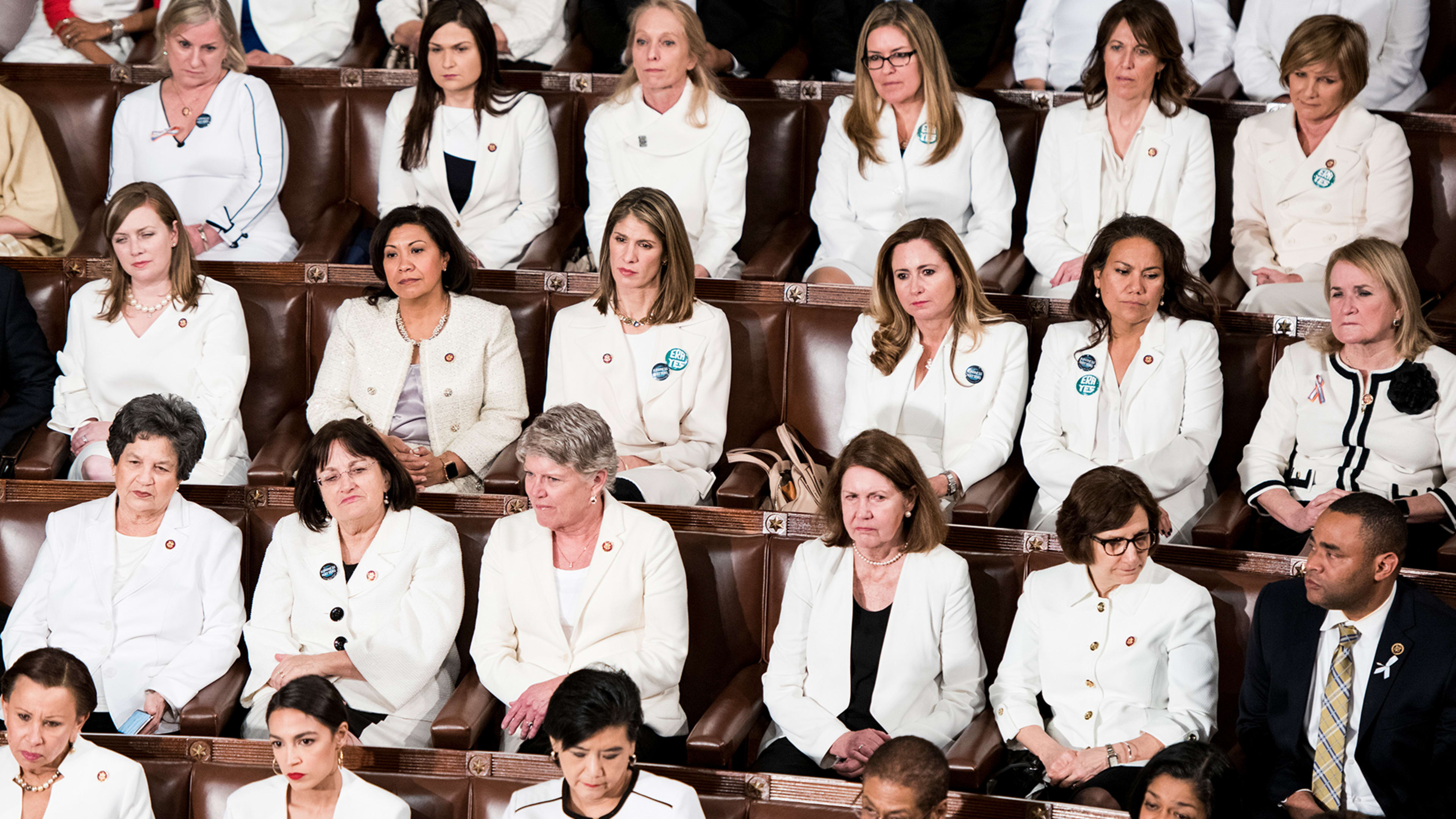 Progressive women are wearing white. They should wear purple and yellow, too