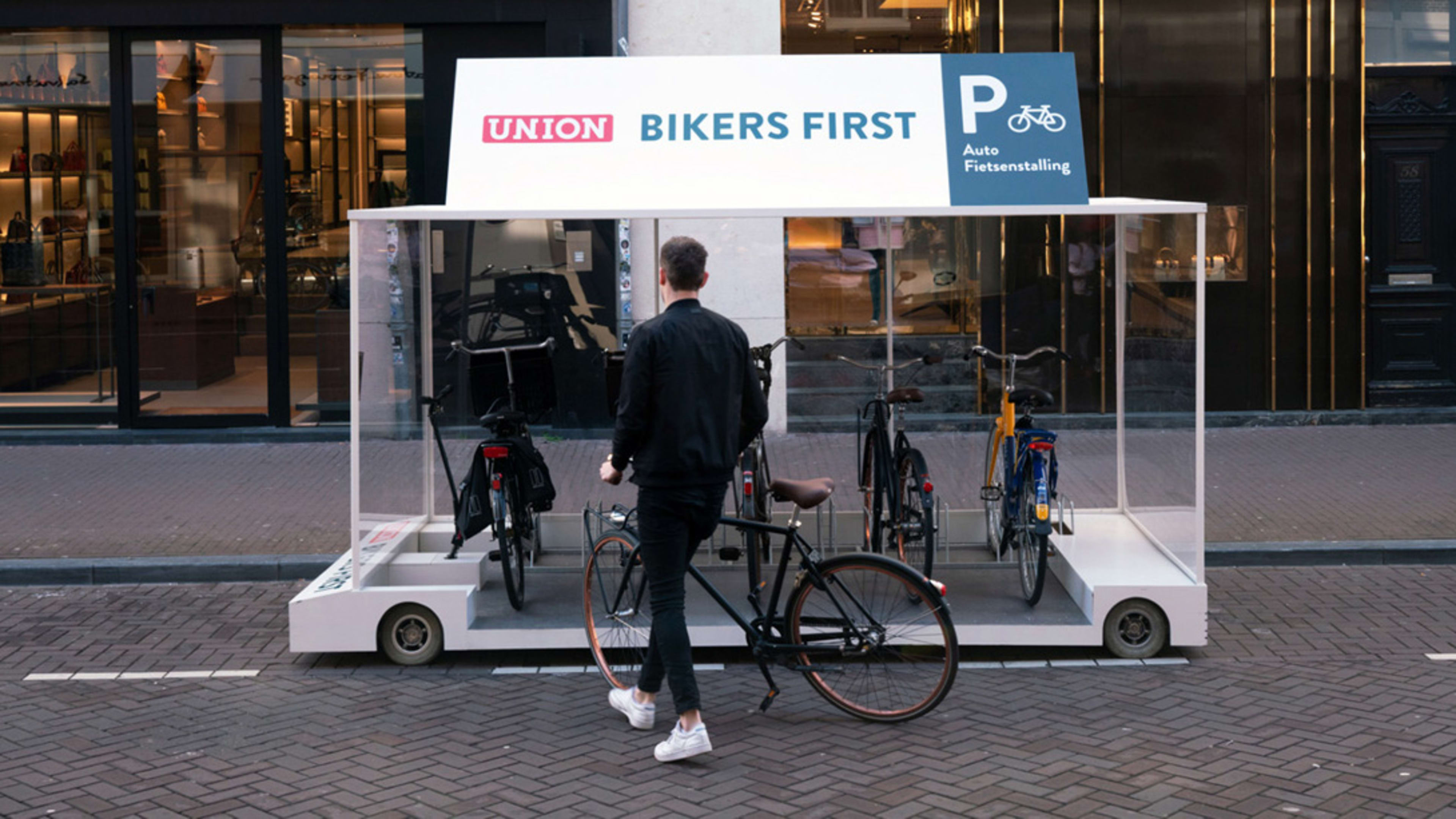 This pop-up bike rack is designed to take over a parking space