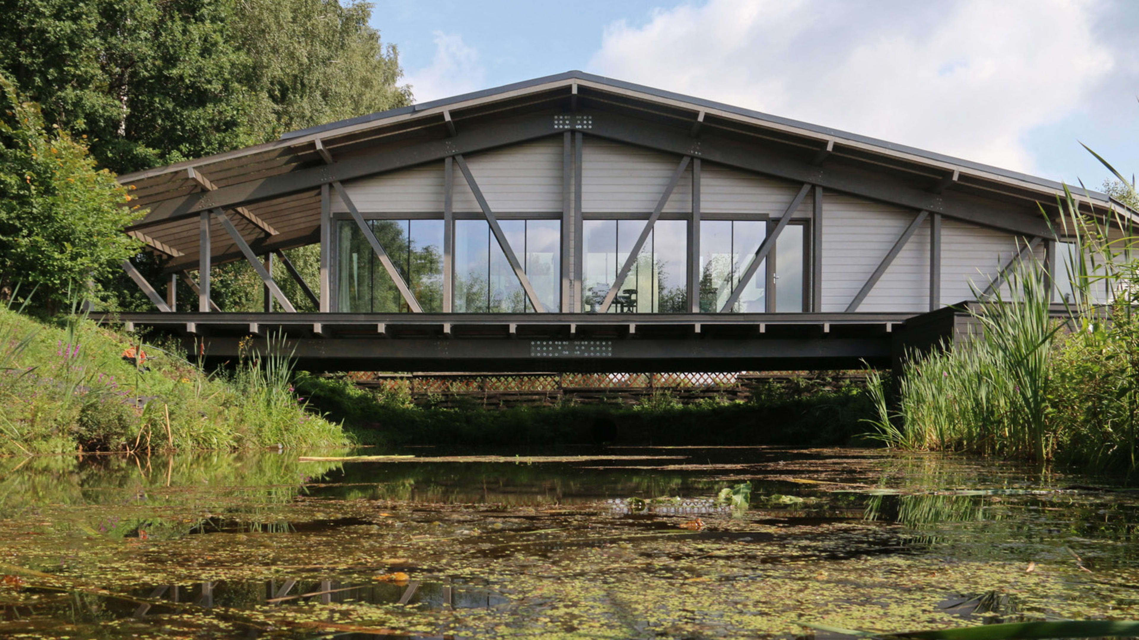 Would you live on a bridge? This elegant home hovers over a river