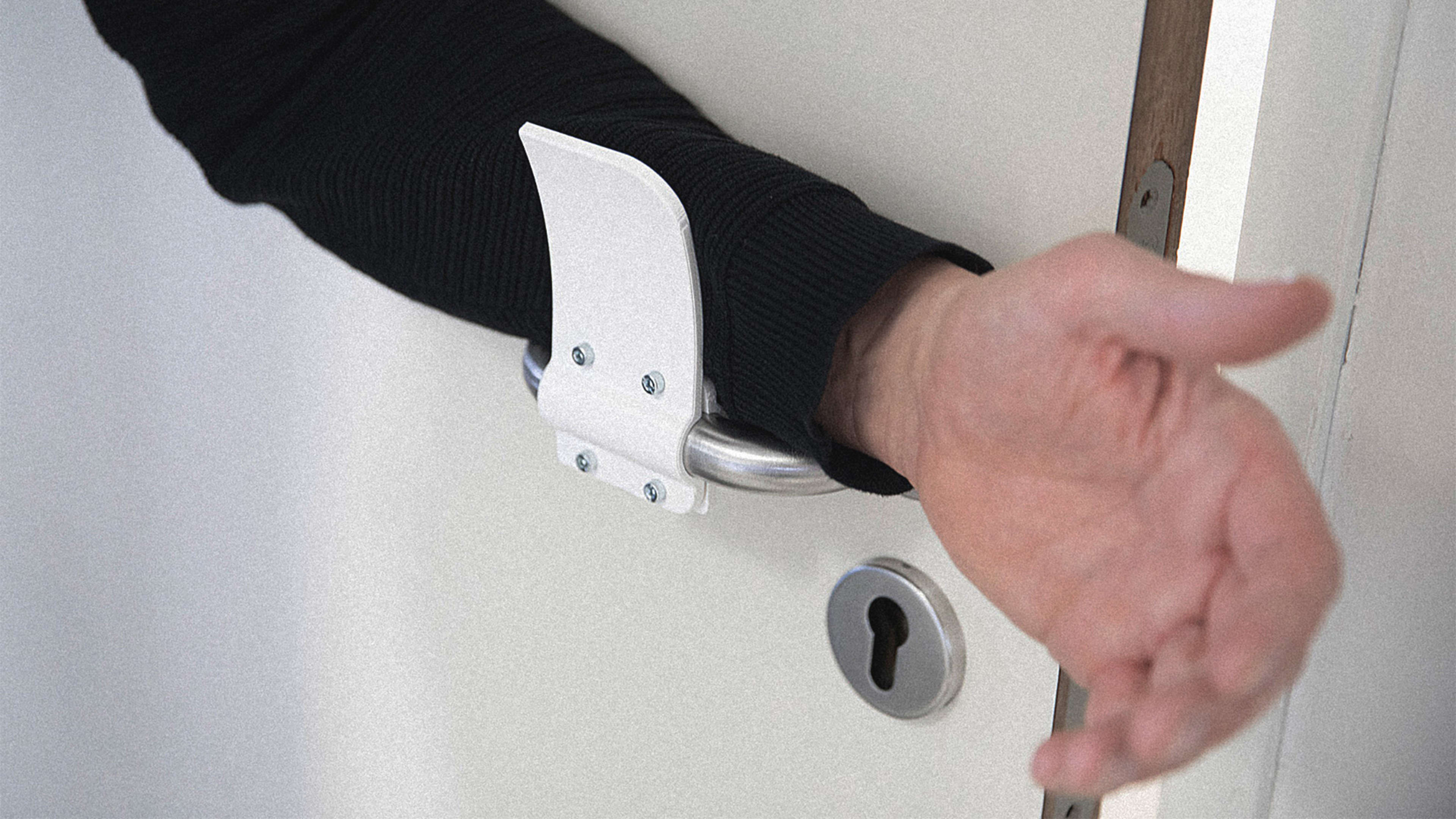 This simple 3D-printable attachment lets you open doors hands-free