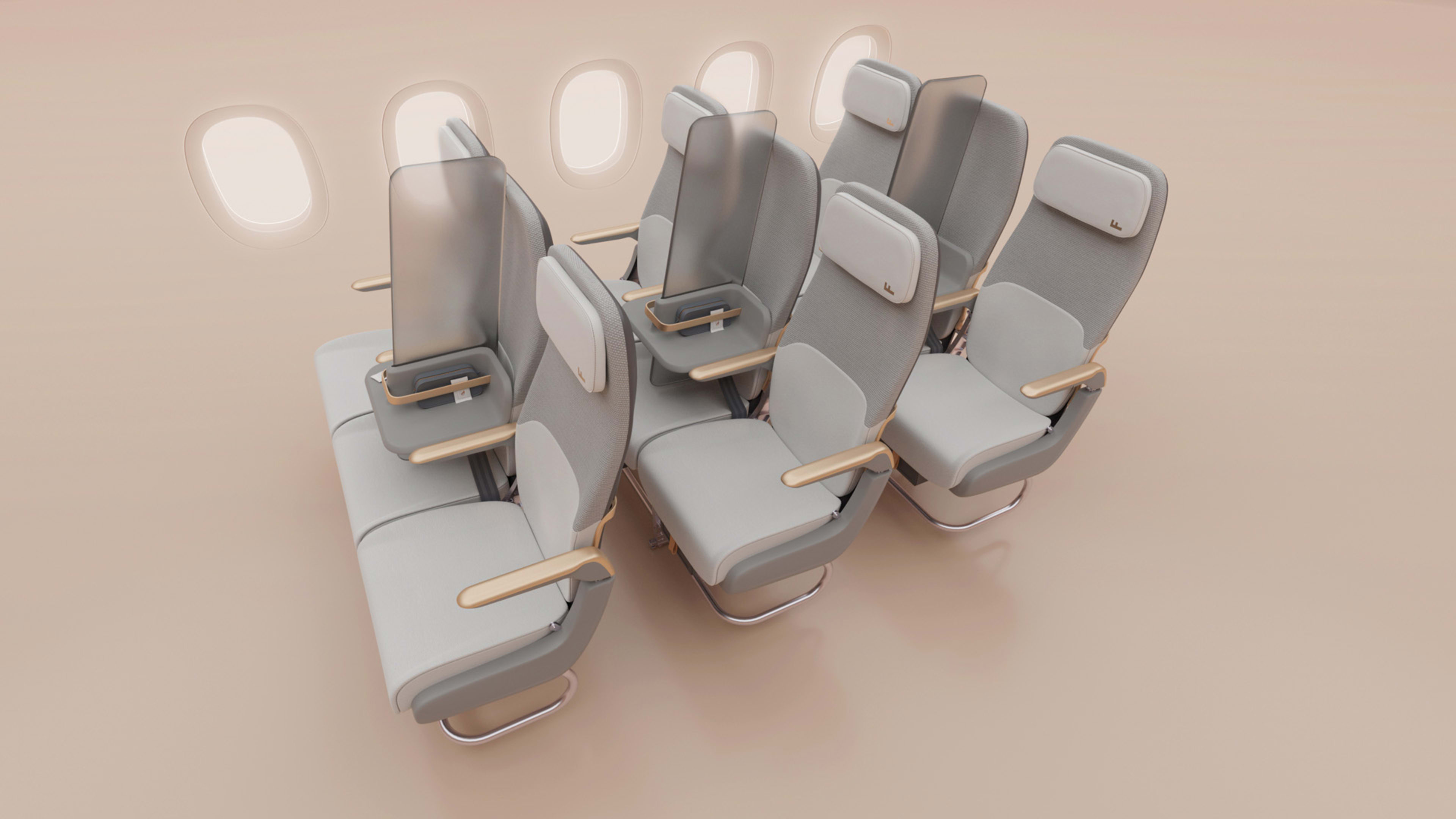 Designers turn an airplane’s middle seat into a COVID-19 sneeze guard