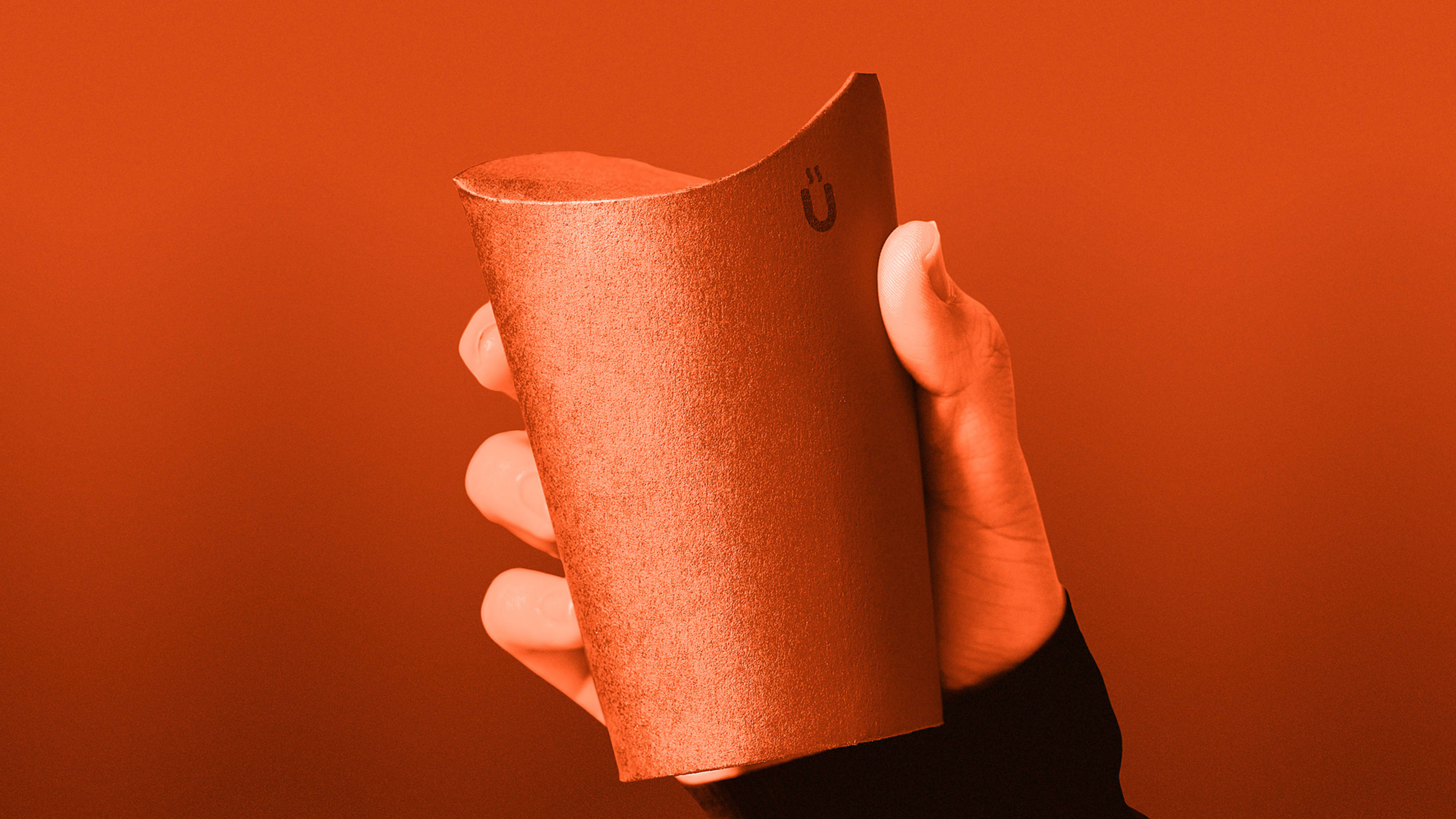 This folding coffee cup eliminates the need for a plastic lid