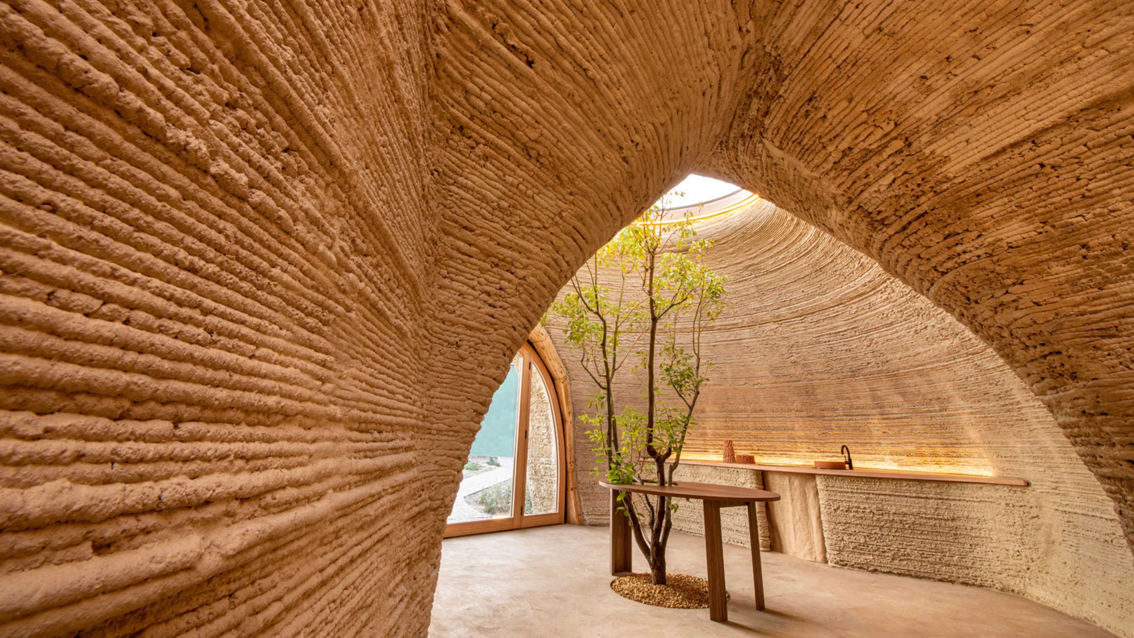 This wild-looking house is made out of dirt by a giant 3D printer
