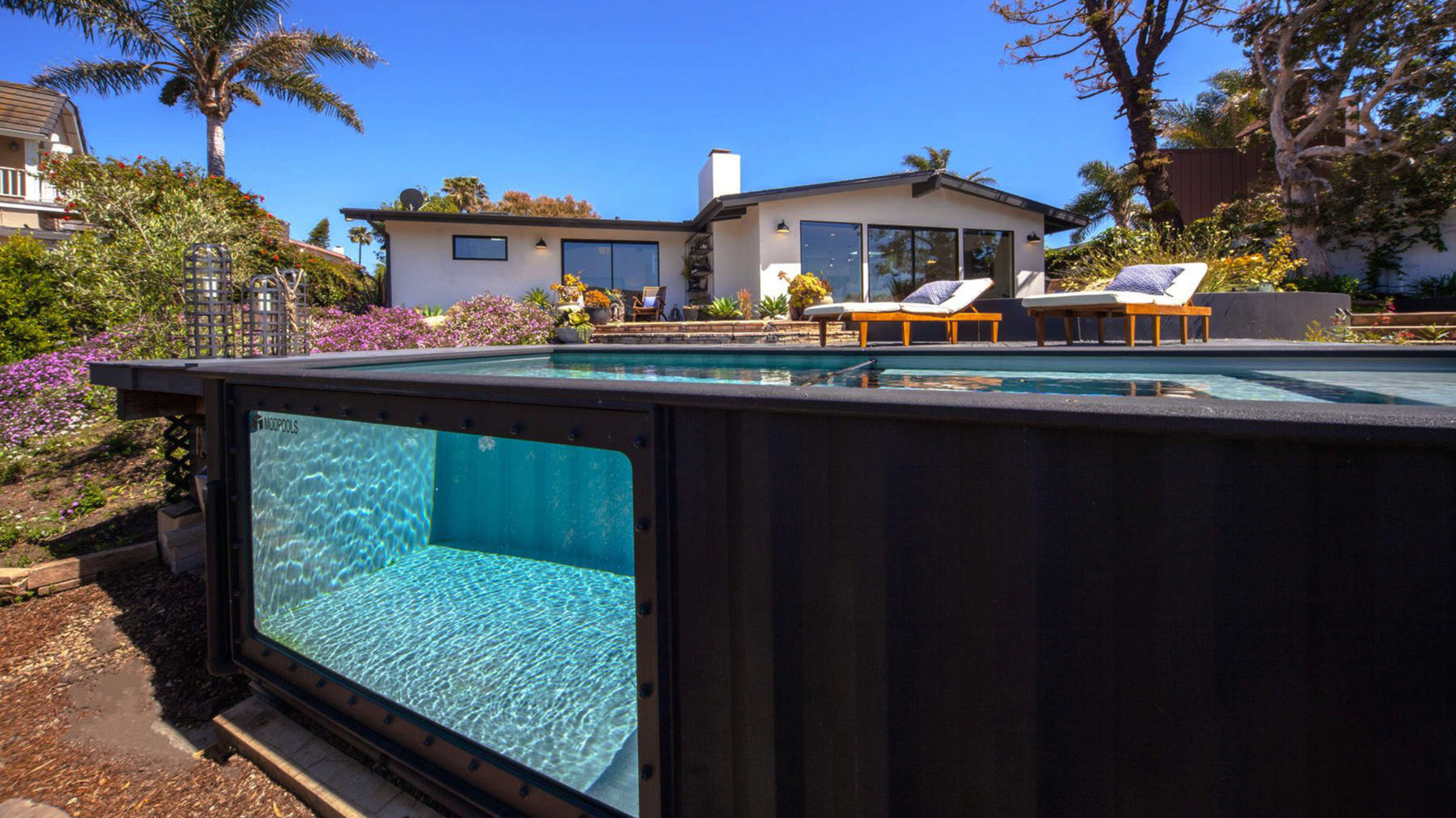 This company recycles shipping containers into backyard swimming pools