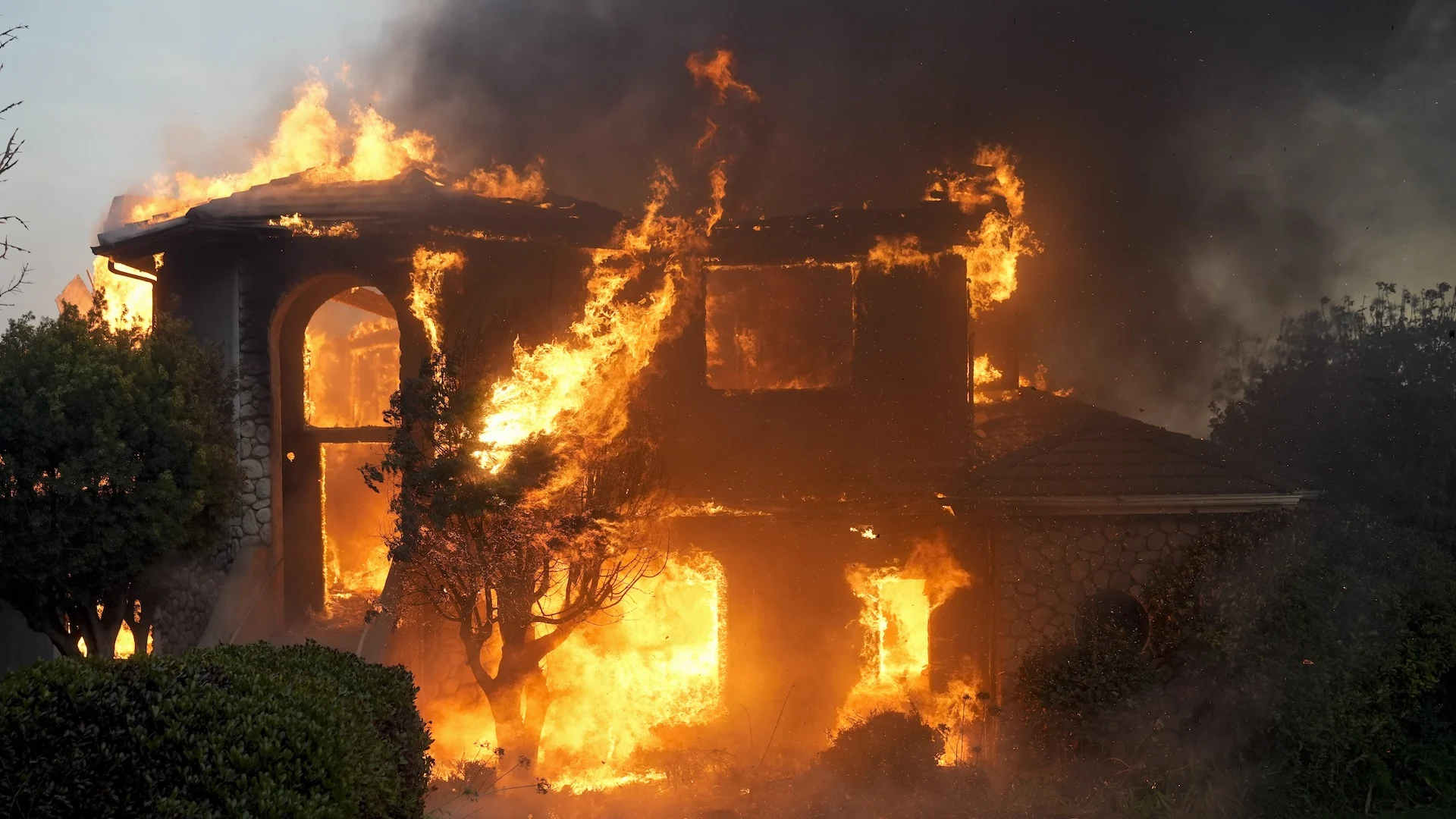 A fire burns a house in the Mountain fire, Wednesday, Nov. 6, 2024, in Camarillo, California.