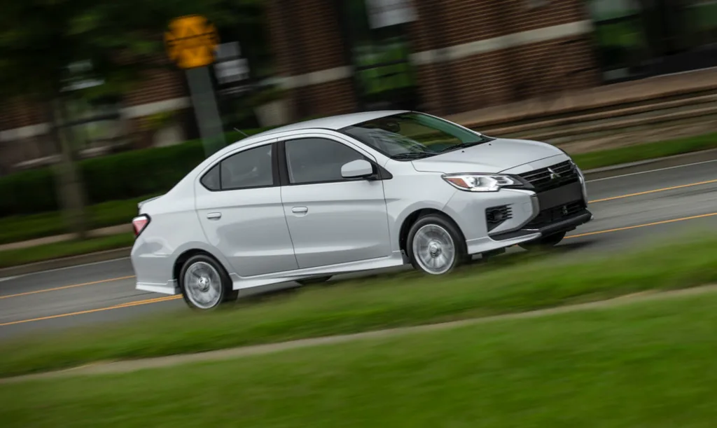 An exterior action photograph of the Mitsubishi Mirage on a roadway.