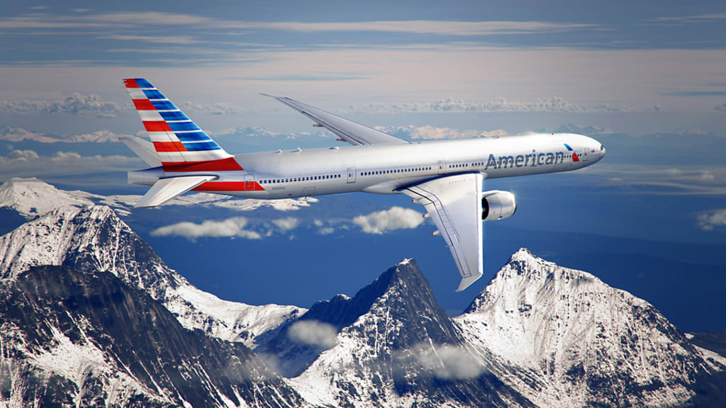 &ldquo;American Airlines jet showcasing new livery design and branding on airport tarmac&rdquo;