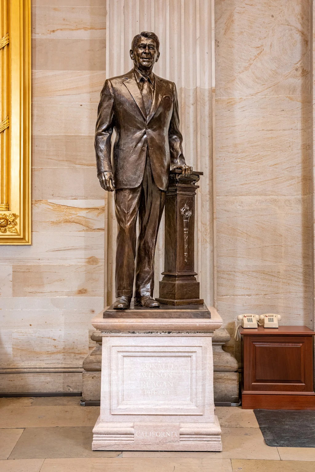 A photo of California's statue of Ronald Reagan, including the pedestal designed by McCreary architects, in the National Statuary Hall Collection.