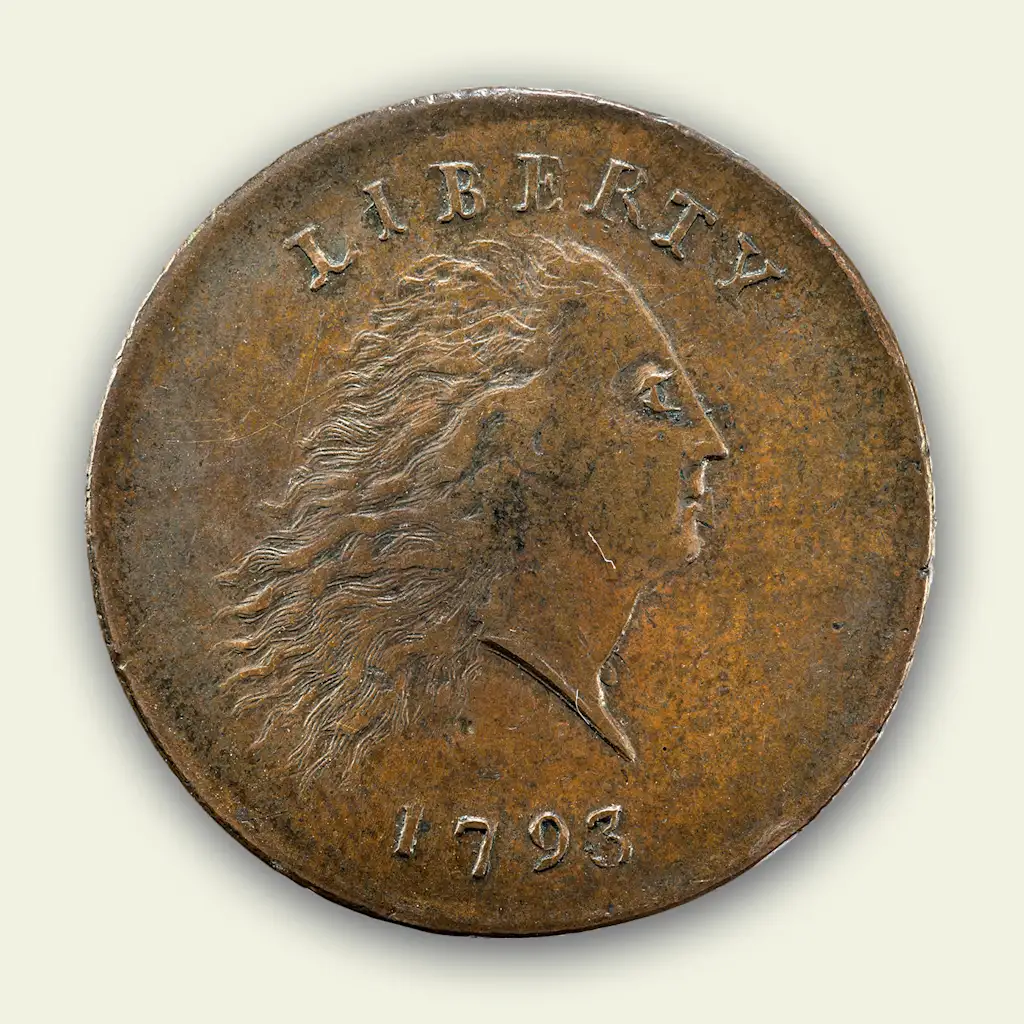 The face side of a 1793 penny, featuring a woman's profile representing liberty.