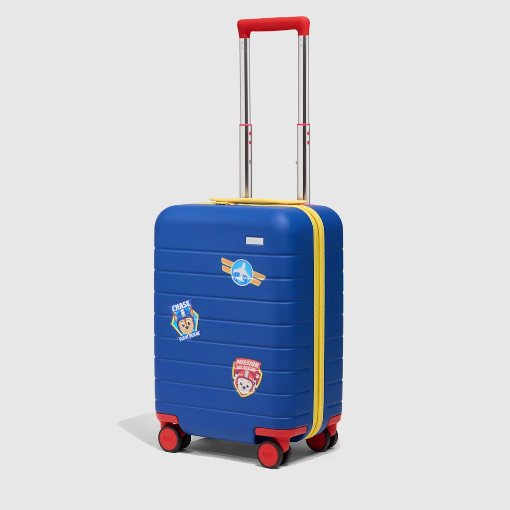 A primary blue suitcase, with yellow and red accent colors