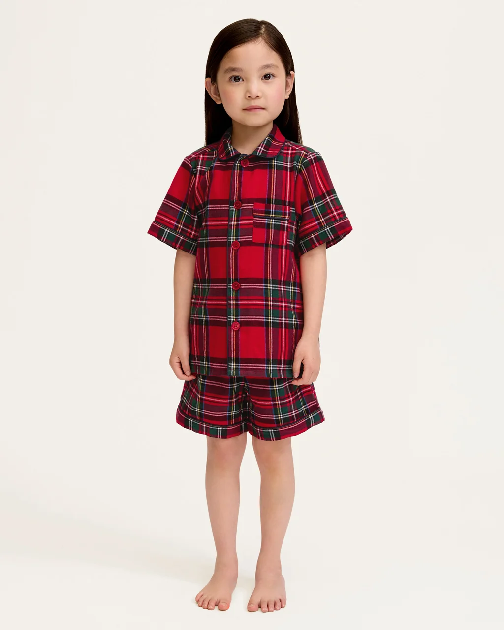 a child in red flannel pajamas