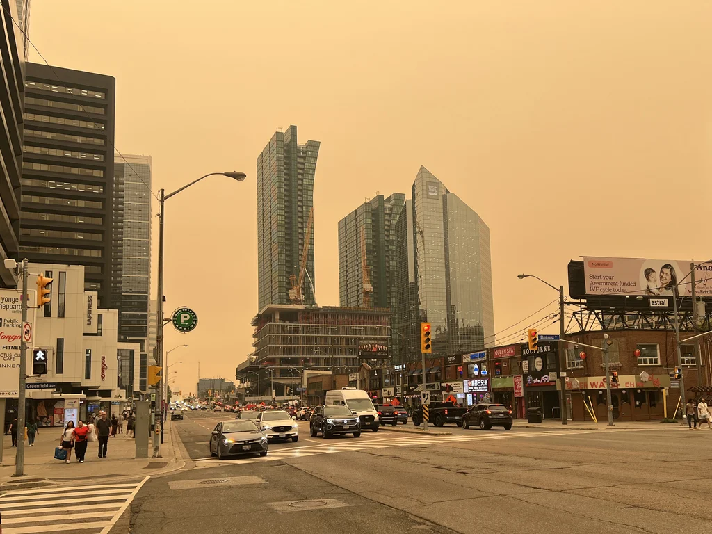 Orange haze hangs over a cityscape