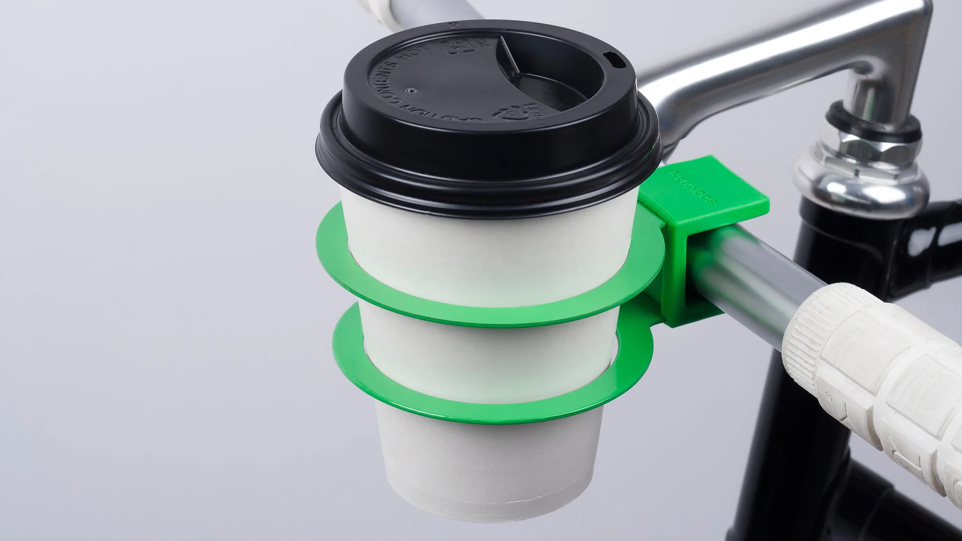 Minimalist Clip-On Cup Holder Encourages Drinking (Coffee) And Driving (A  Bike) - Fast Company