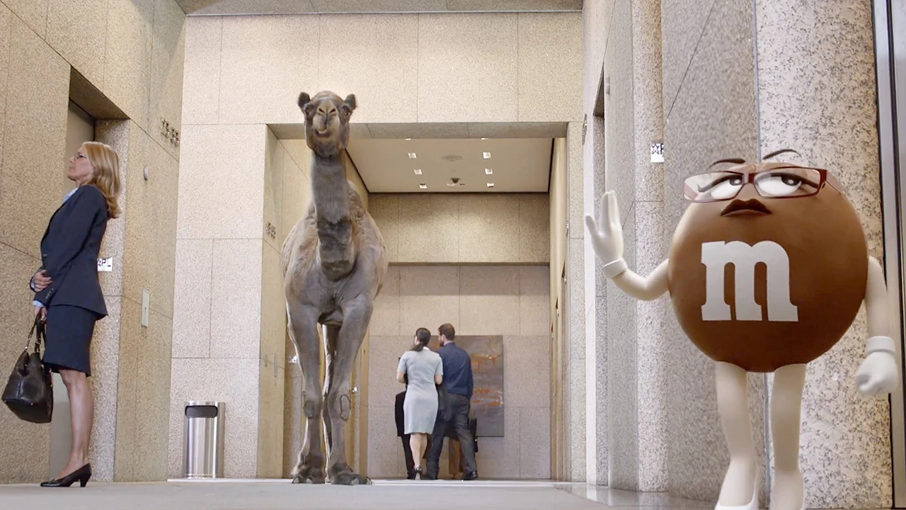 Ad Worlds Collide As Geico Gecko Stars In New M&M Commercial Fast Company