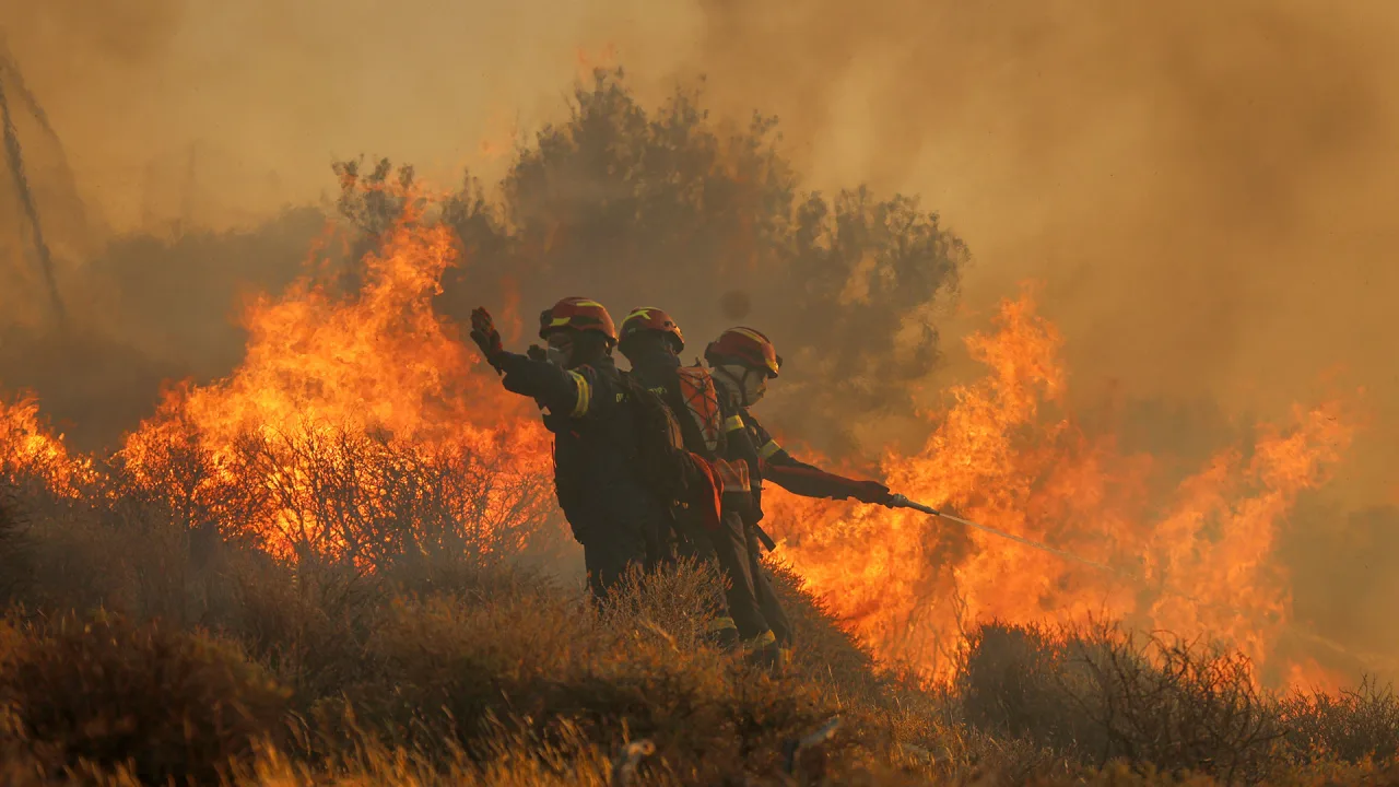 Out of control wildfire on Greek island unleashes evacuations in homes and hotels