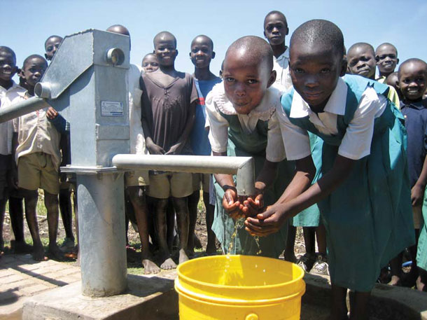A working pump can make all the difference, as it does for these schoolgirls in Kisumu, Kenya. The pump was installed by White’s original charity, WaterPartners. | Photograph courtesy of Water.org
